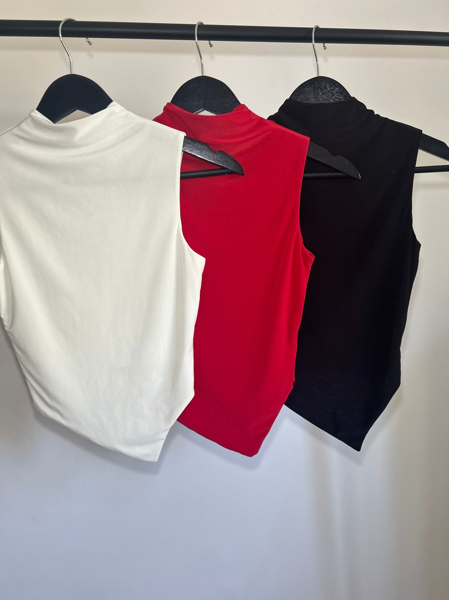 SLINKY HIGH NECK GATHERED ASYMMETRICAL HEM TOP