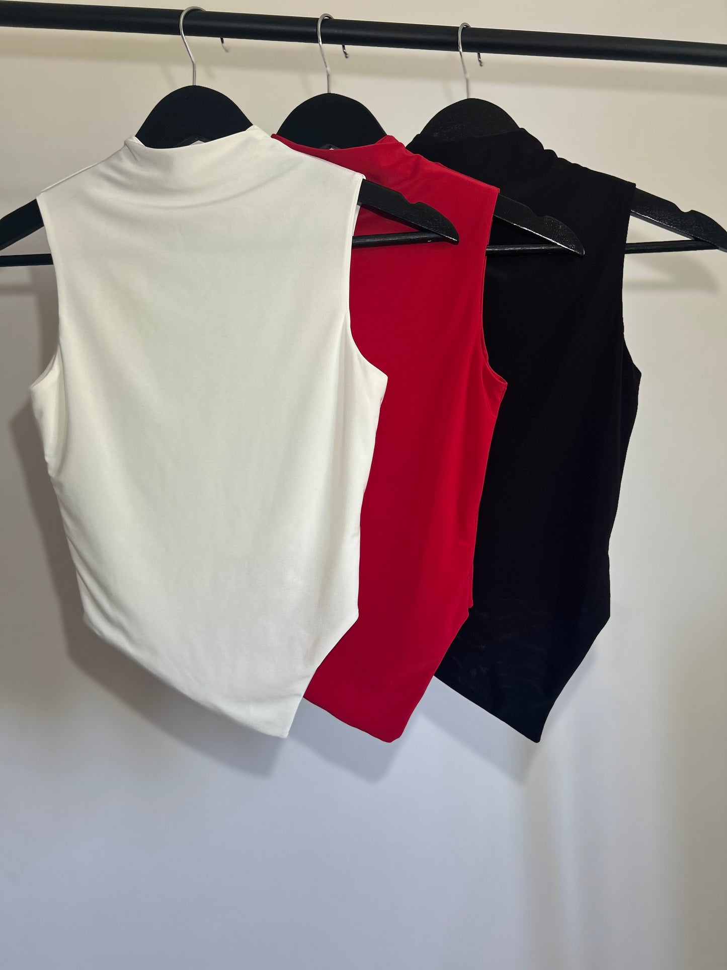 SLINKY HIGH NECK GATHERED ASYMMETRICAL HEM TOP