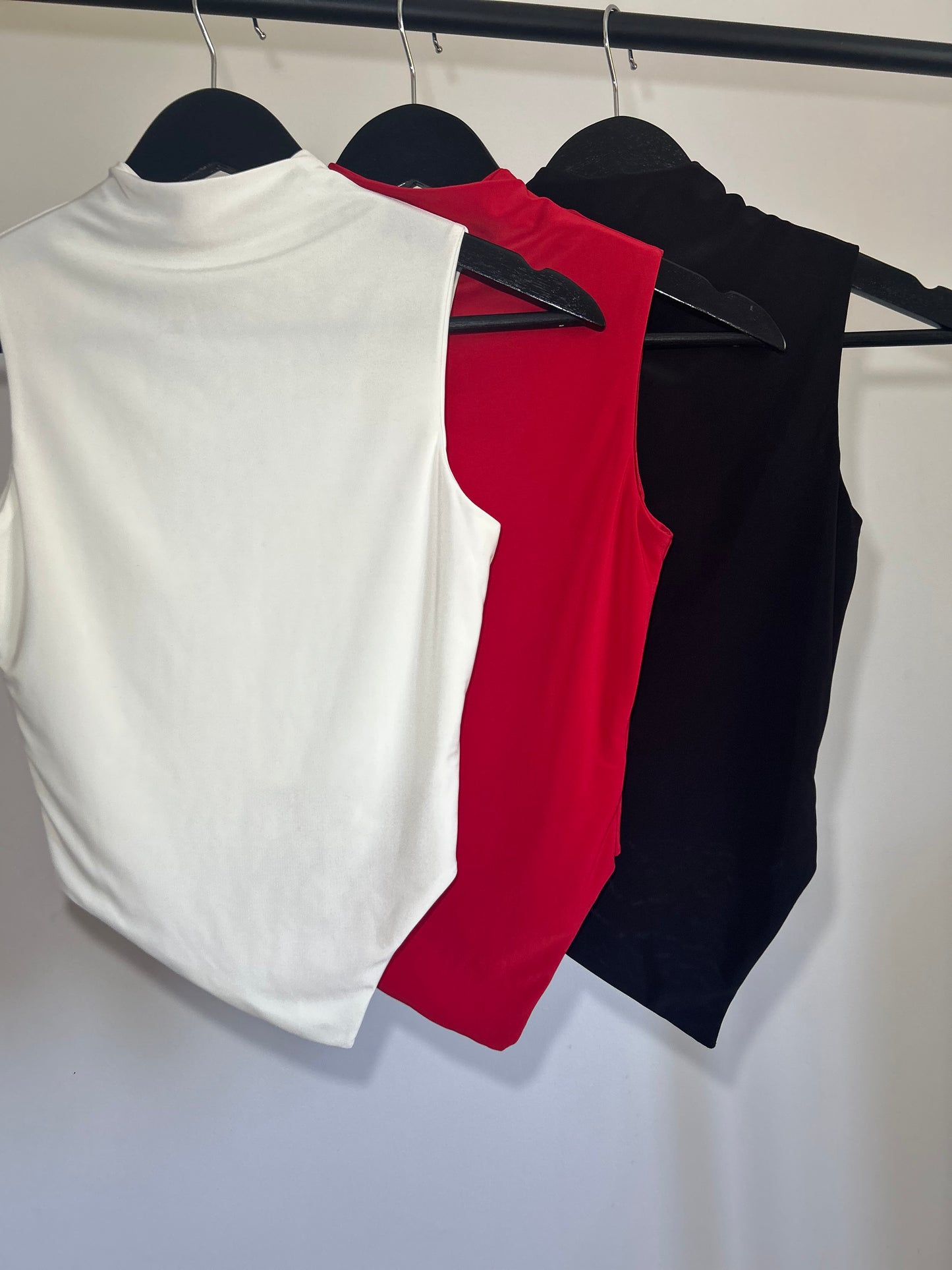 SLINKY HIGH NECK GATHERED ASYMMETRICAL HEM TOP